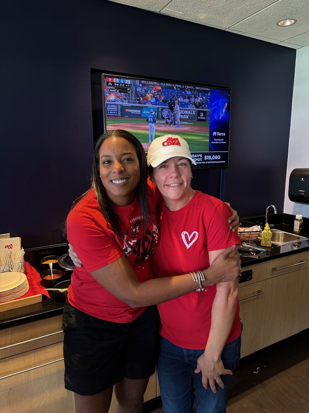 Two Edgesource teammates laughing together at a company event